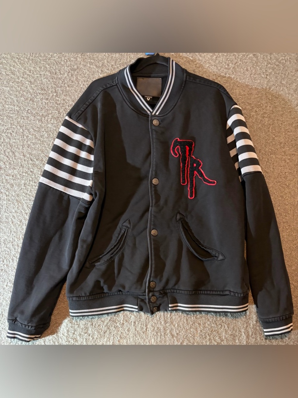 True Religion Black Bomber Jacket with White Striped Sleeves and Red Patch